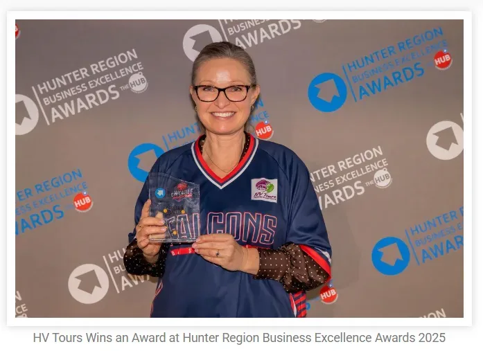 Julie Newman of HV Tours wearing a Newcastle Falcons shirt while receiving an award at the Hunter Region Business Excellence Awards 2025.