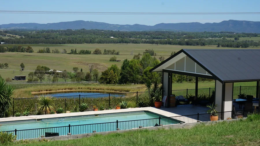 A covered patio and pool at a Hunter Valley lodge