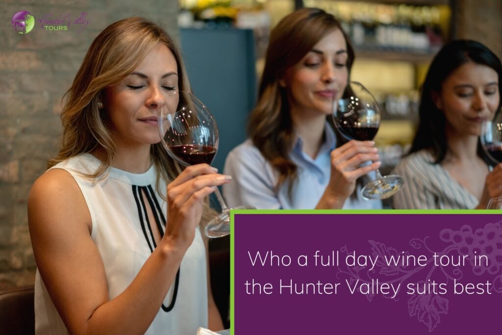 Three women smelling red wine during a tasting
